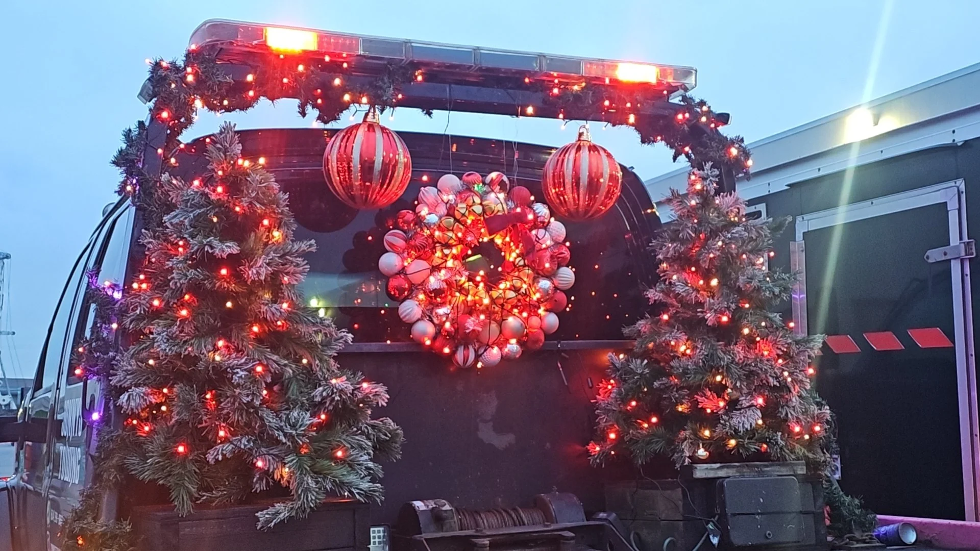 Christmas decorated Jonny's Towing truck